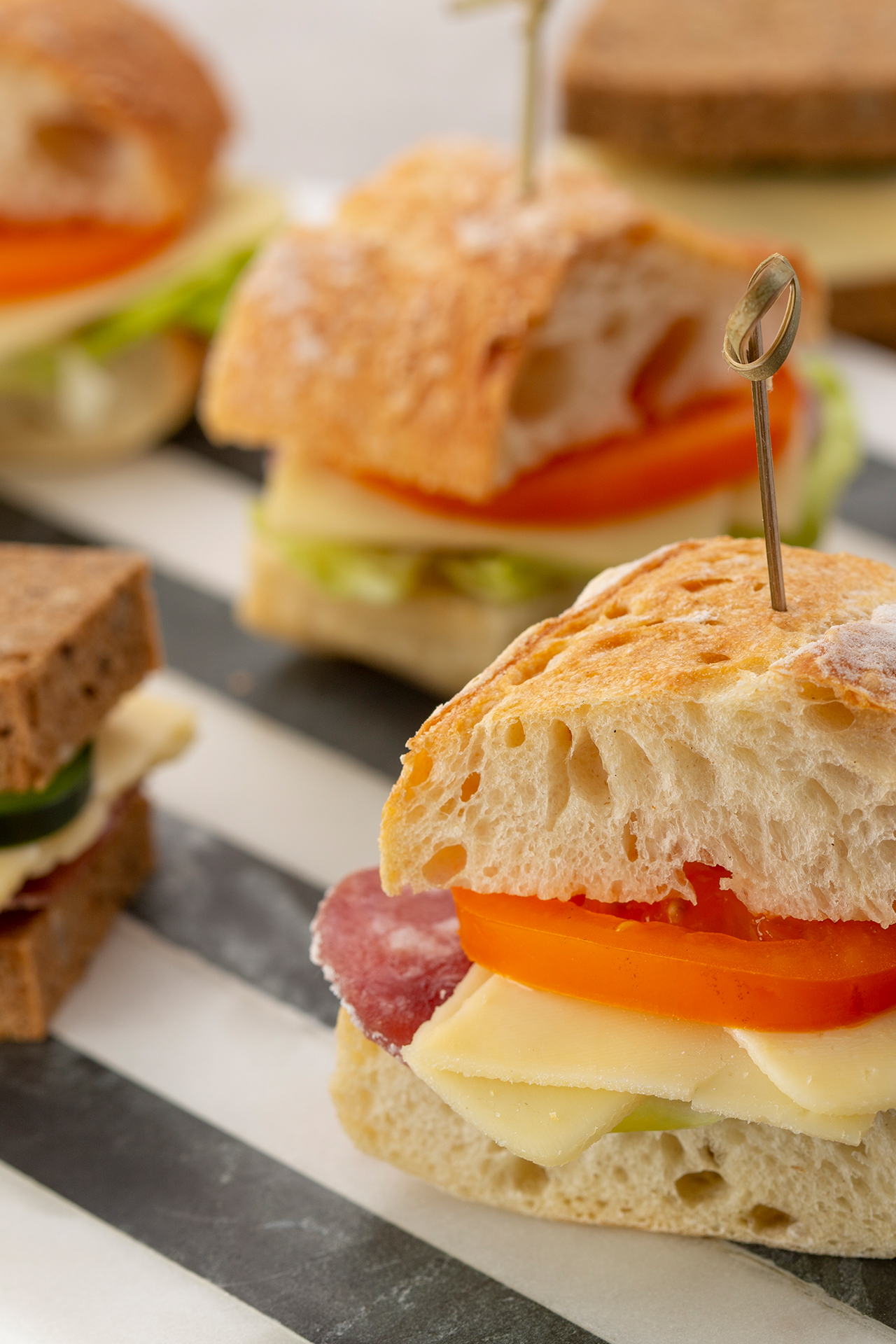 Mini sandwiches with Brie slices Mini sandwiches with Brie slices