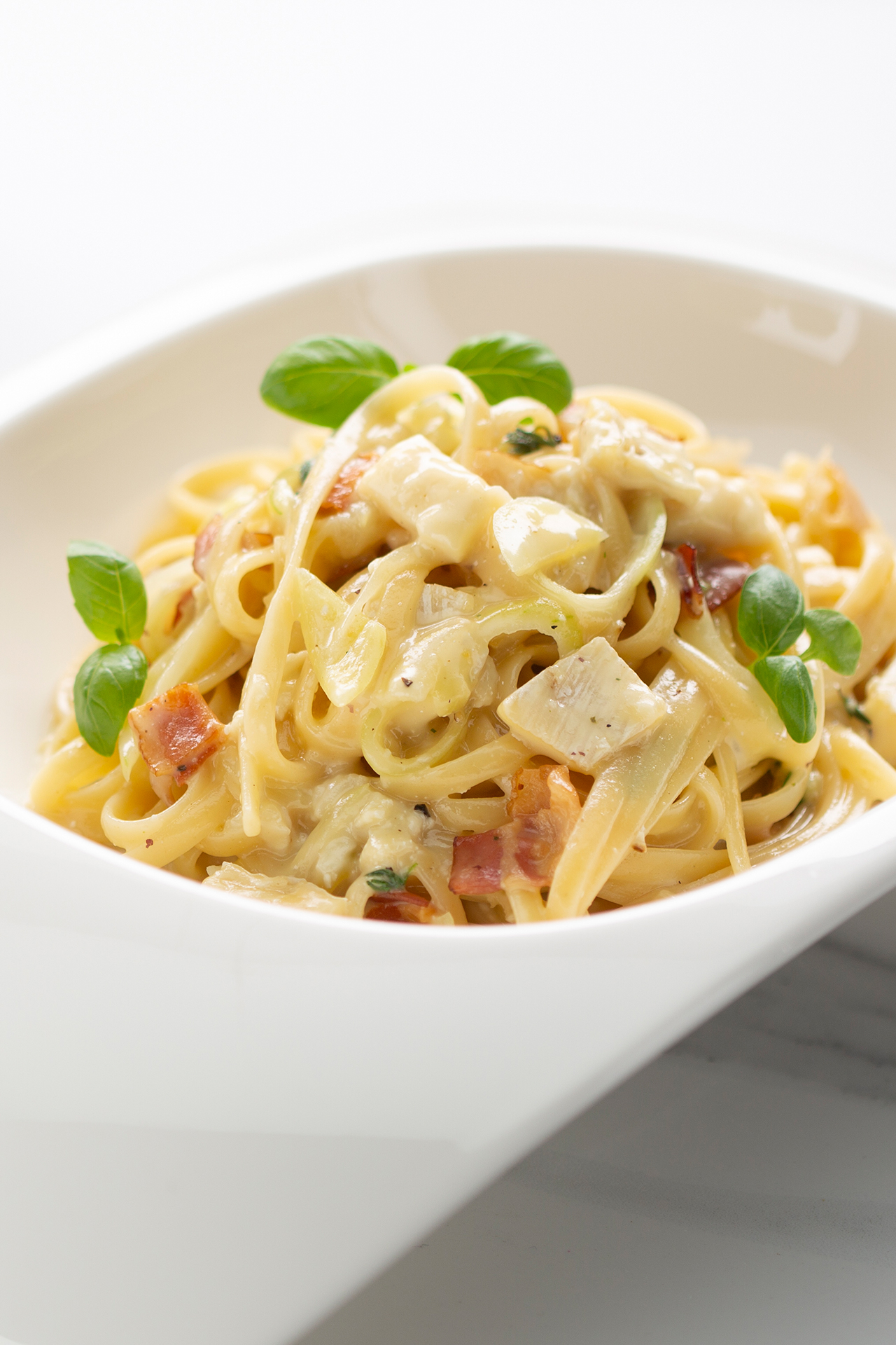 Easy style pasta with Petit Brie, bacon and basil Easy style pasta with Petit Brie, bacon and basil
