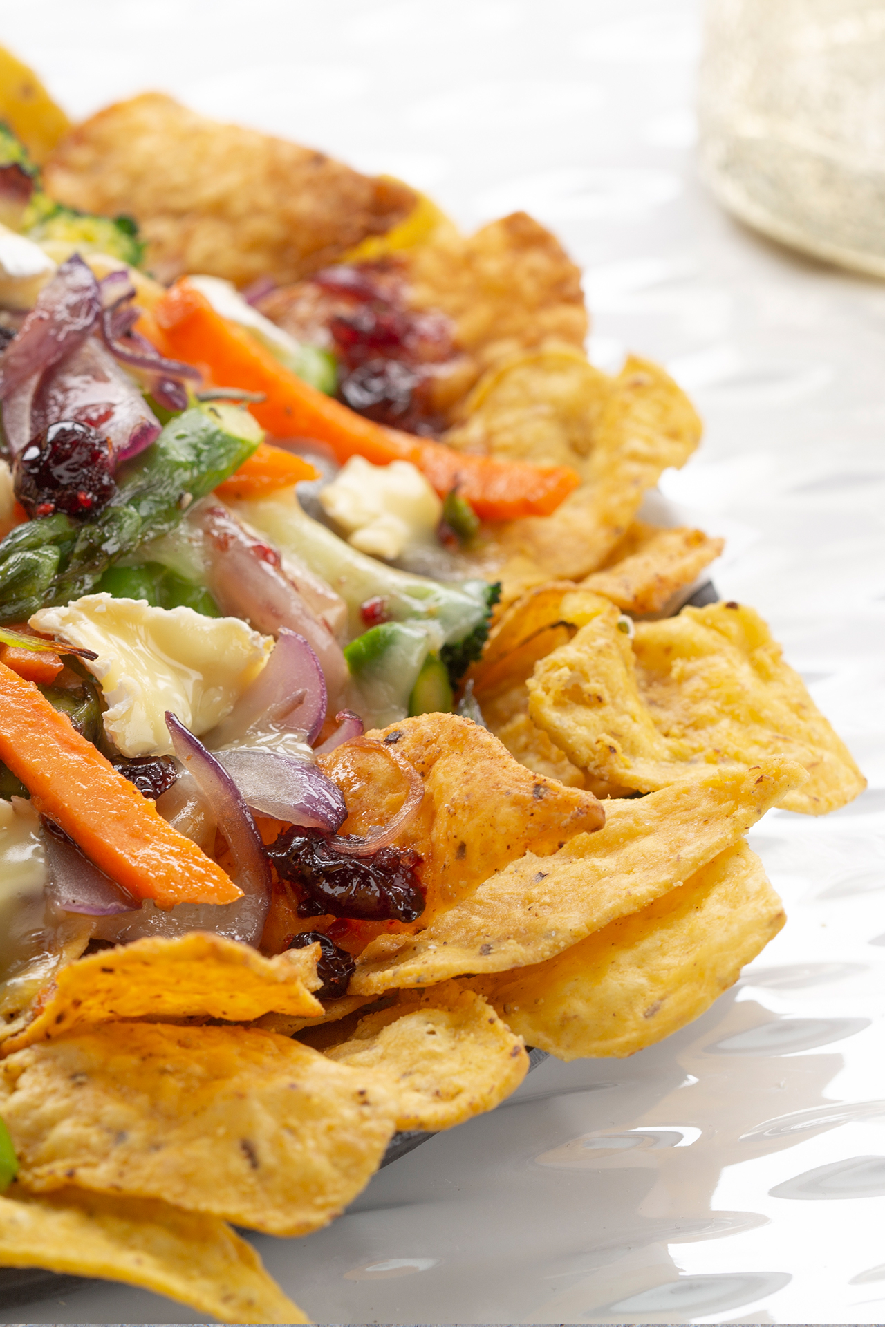 French style nachos with Brie au Bleu and cranberries